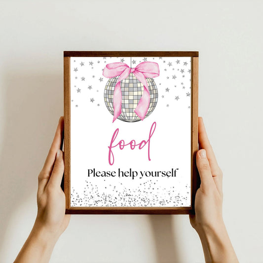 Framed print with a decorative ball and 'Please help yourself' text held by hands against a plain background