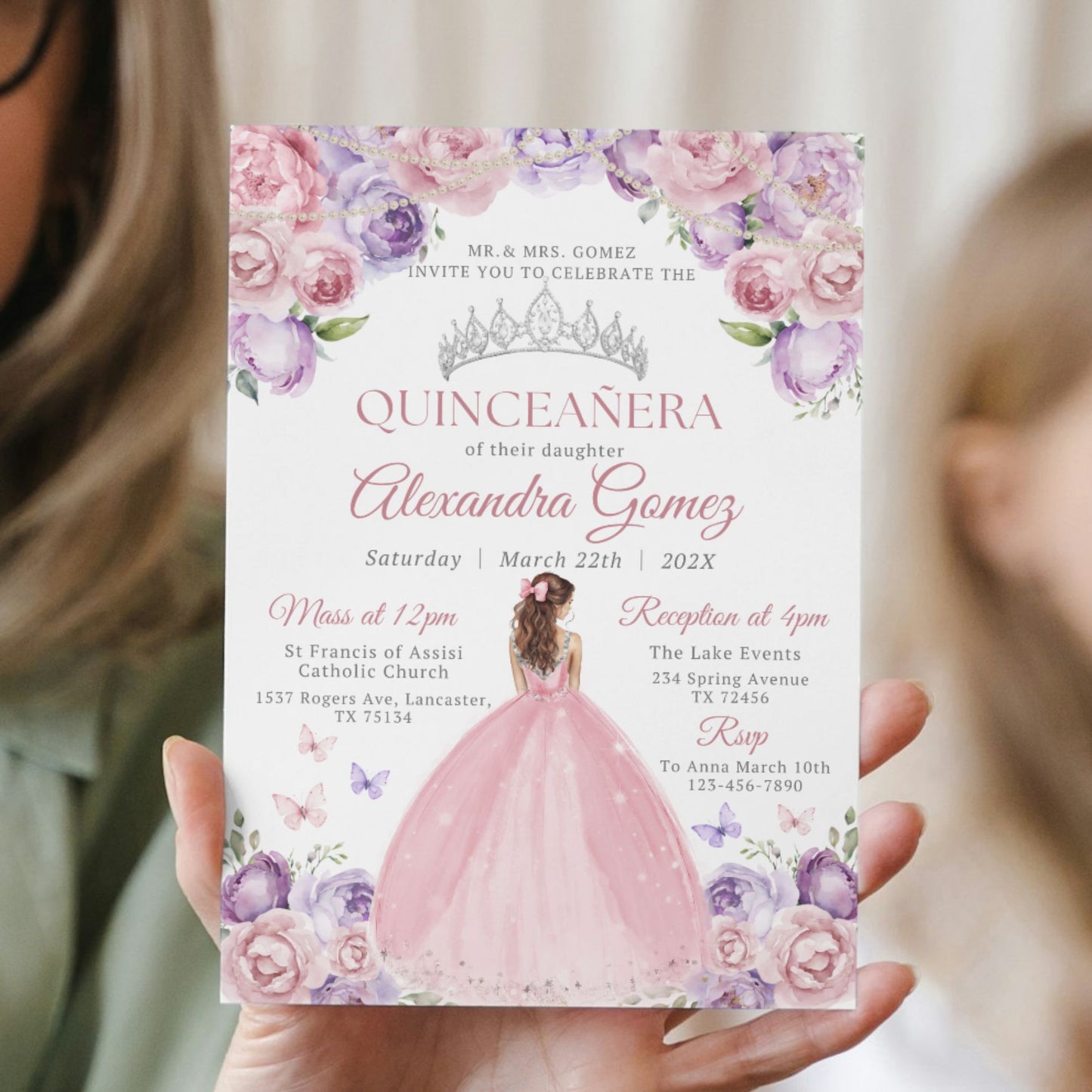 Quinceanera invitation with floral design held by a person