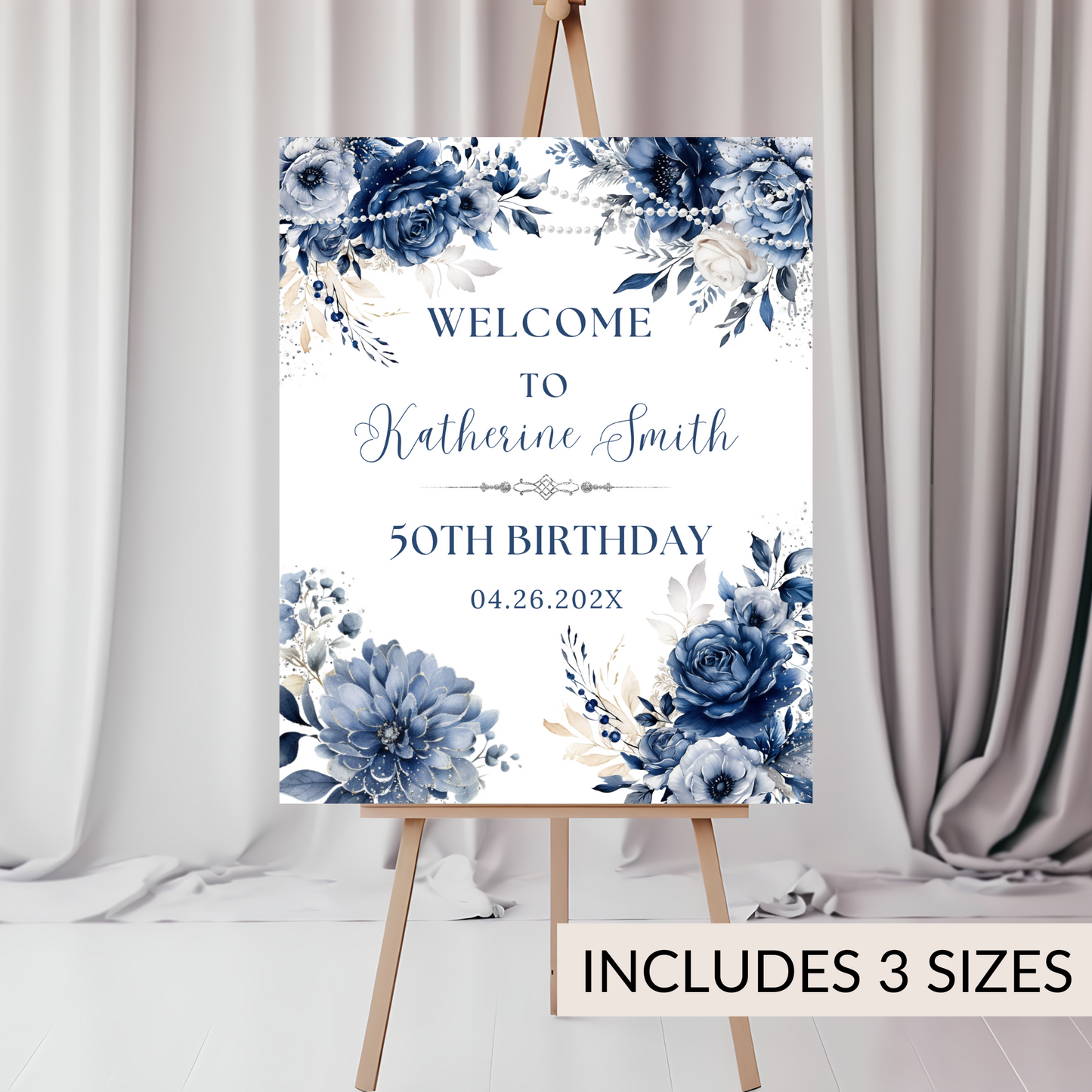 Decorative birthday sign with blue floral design on an easel against a neutral background.
