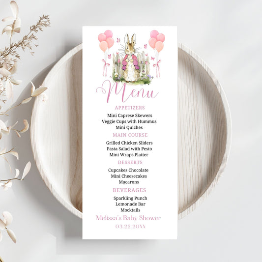 Baby shower menu card with bunny design on a white plate