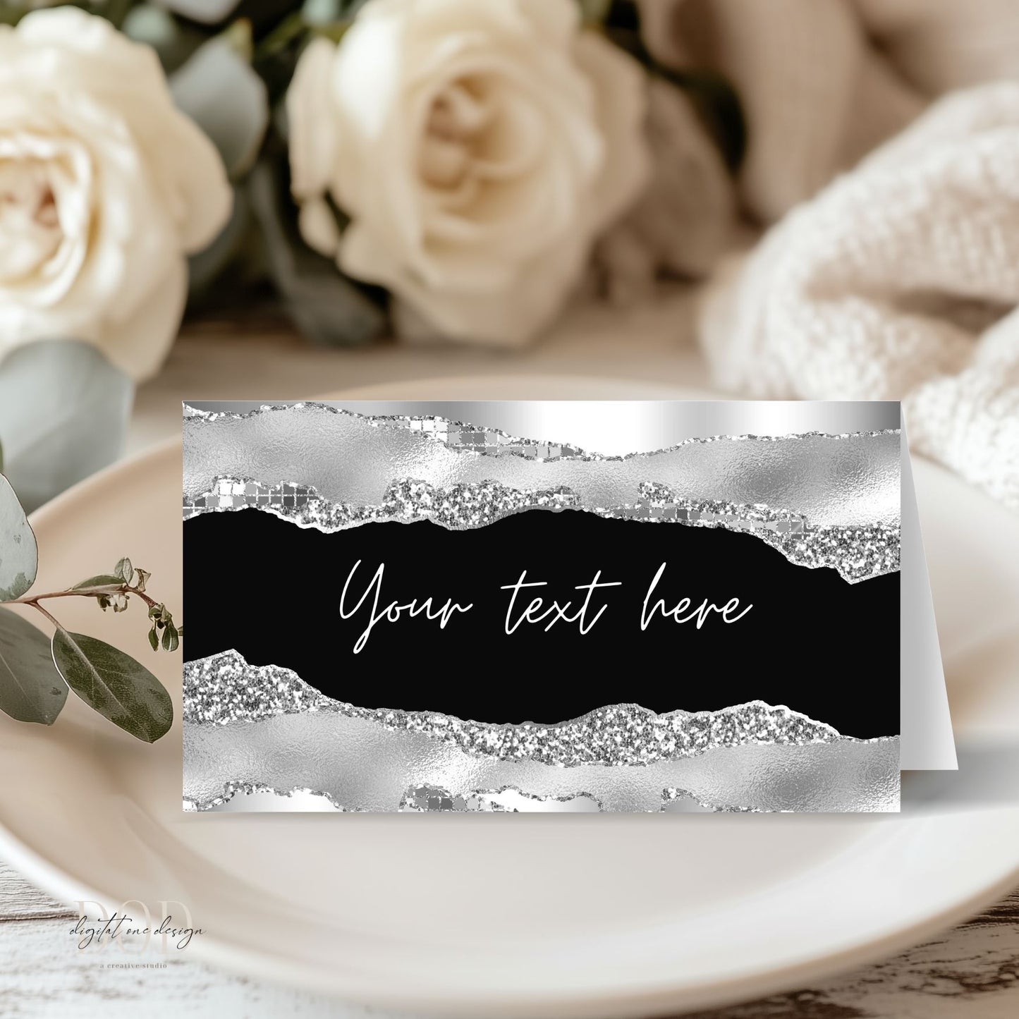 Decorative and elegant Silver & black place card with text placeholder on a table setting with flowers