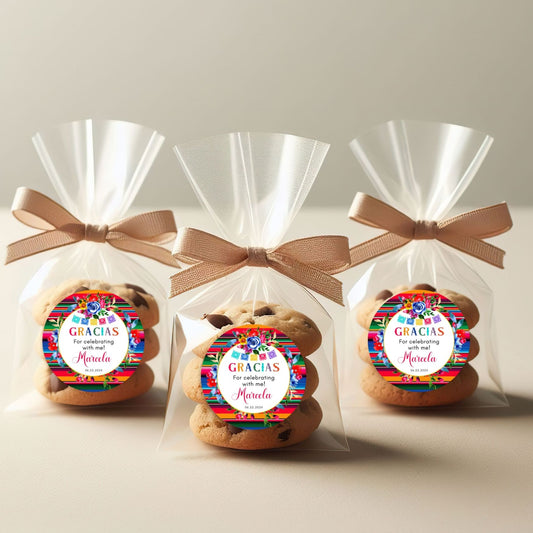 Three cookies in clear bags with colorful Mexican Favor labels and bows on a light background