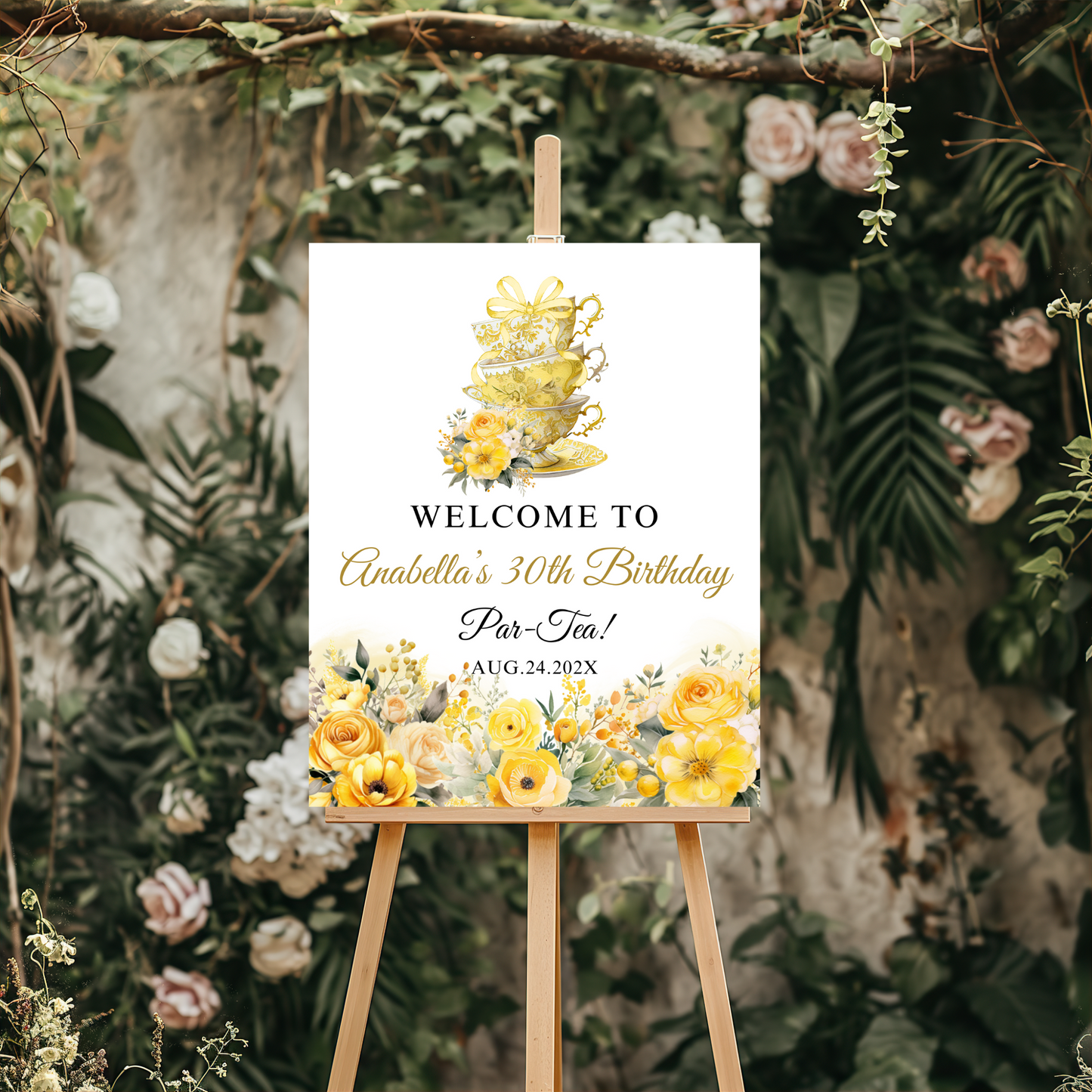 Decorative sign for a tea party birthday celebration with floral and teacup design on an easel.