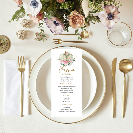Elegant table setting with floral centerpiece, plates, cutlery, and a menu card.