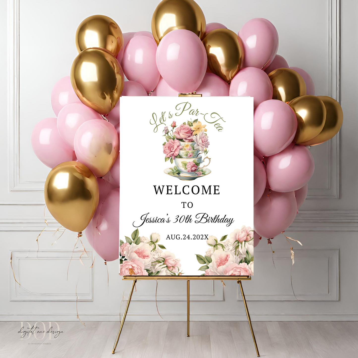 Decorative setup with pink and gold balloons and a personalized welcome sign on a stand.