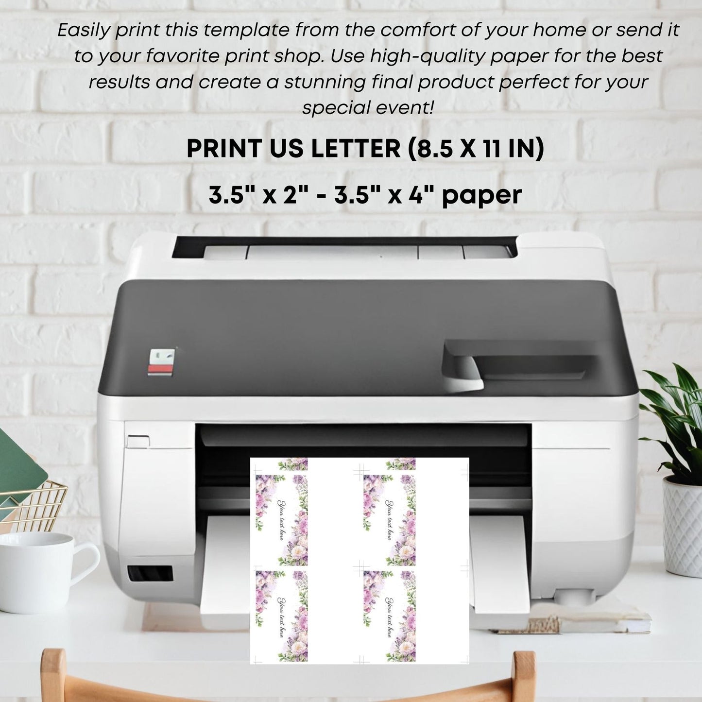 Printer with printed place cards sheet on a white brick wall background