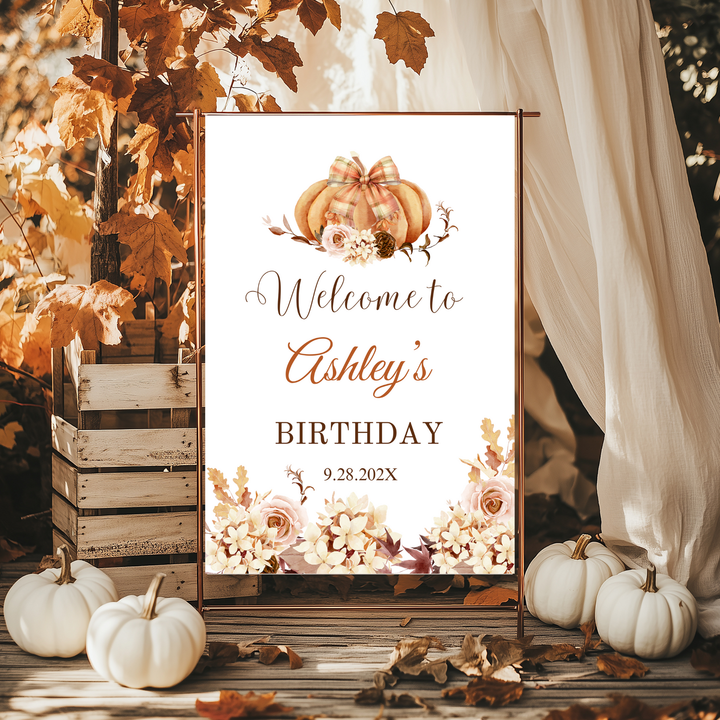 Decorative birthday sign with pumpkins and autumn Floral & leaves, surrounded by pumpkins and a wooden crate.