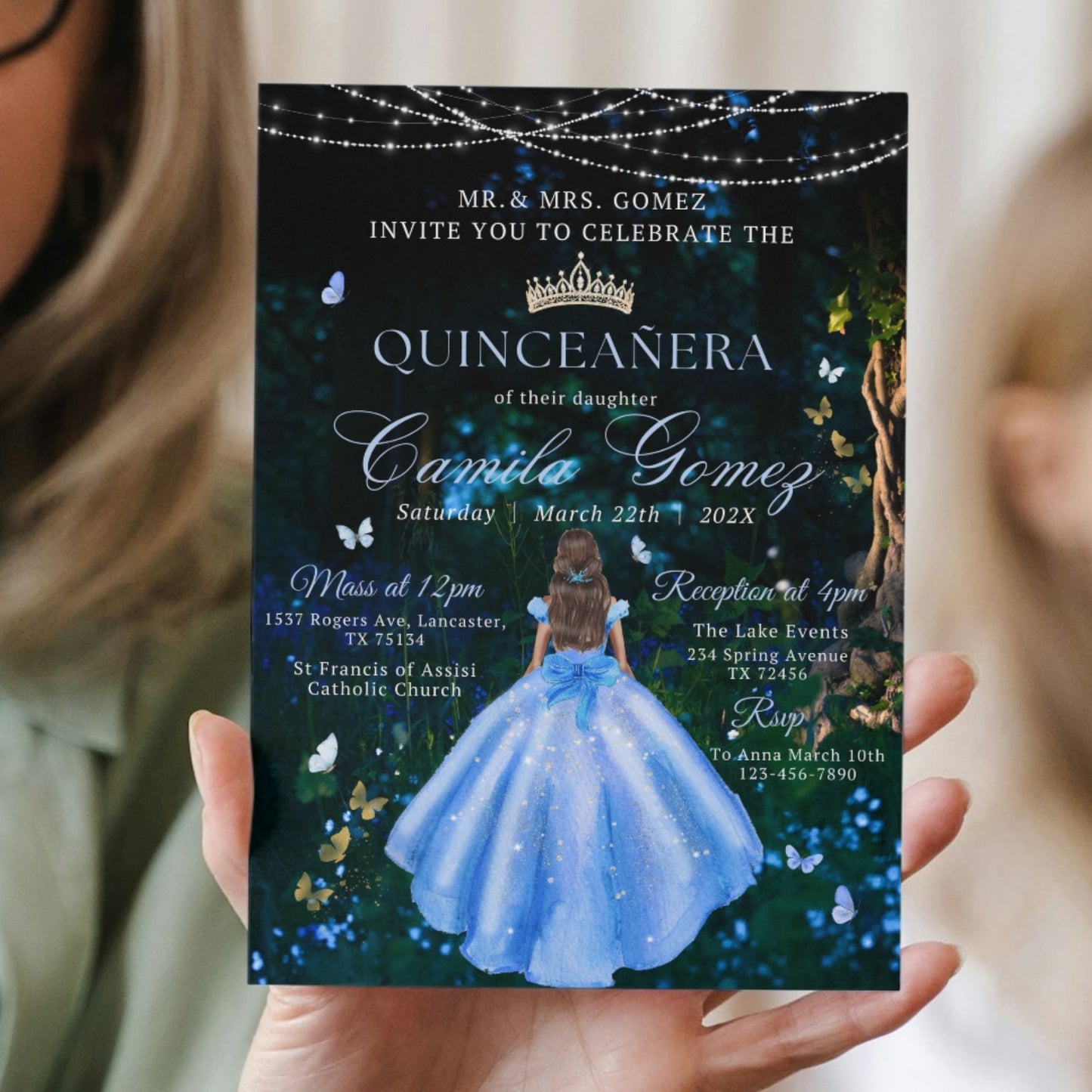 Quinceañera invitation held by a person with a blue dress design on a dark background.