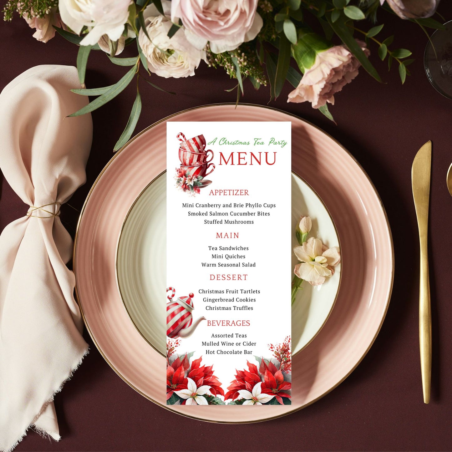 Peppermint Tea Cups & Poinsettia Flowers Christmas-themed menu card on a plate with floral decorations and cutlery.