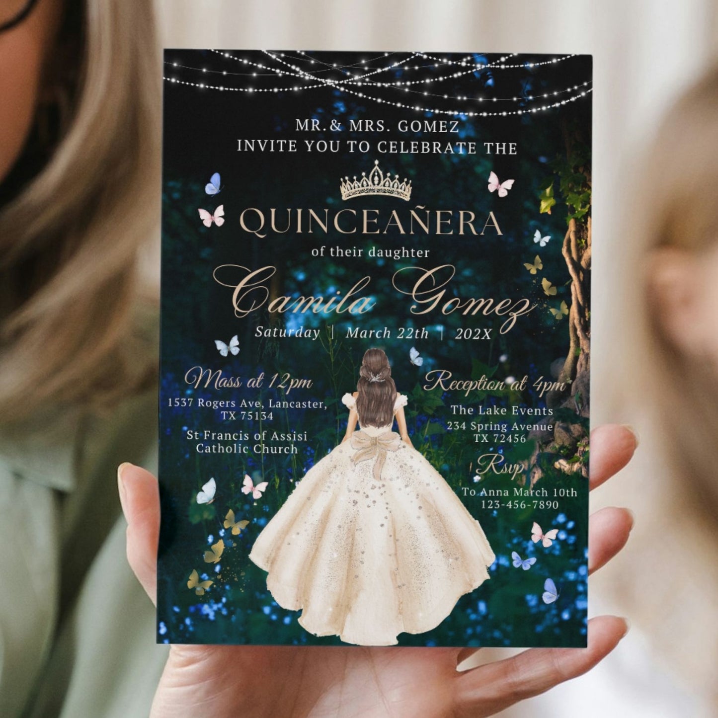 Magical Quinceañera invitation held by a person with a dark background featuring butterflies and lights.