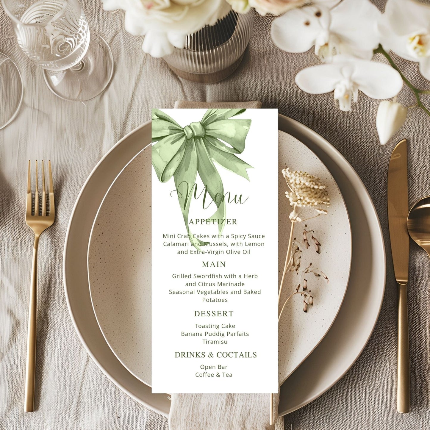 Table setting with a menu card featuring a sage green bow design.