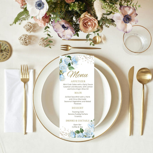 Table setting with floral centerpiece, plates, cutlery, and a floral menu card.