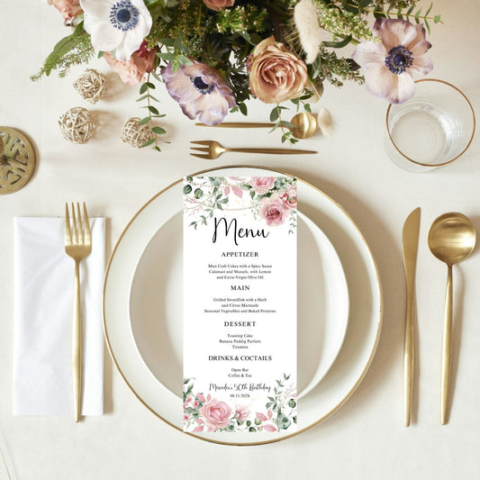 Table setting with Pink floral and pearls menu card, plates, cutlery, and flowers.