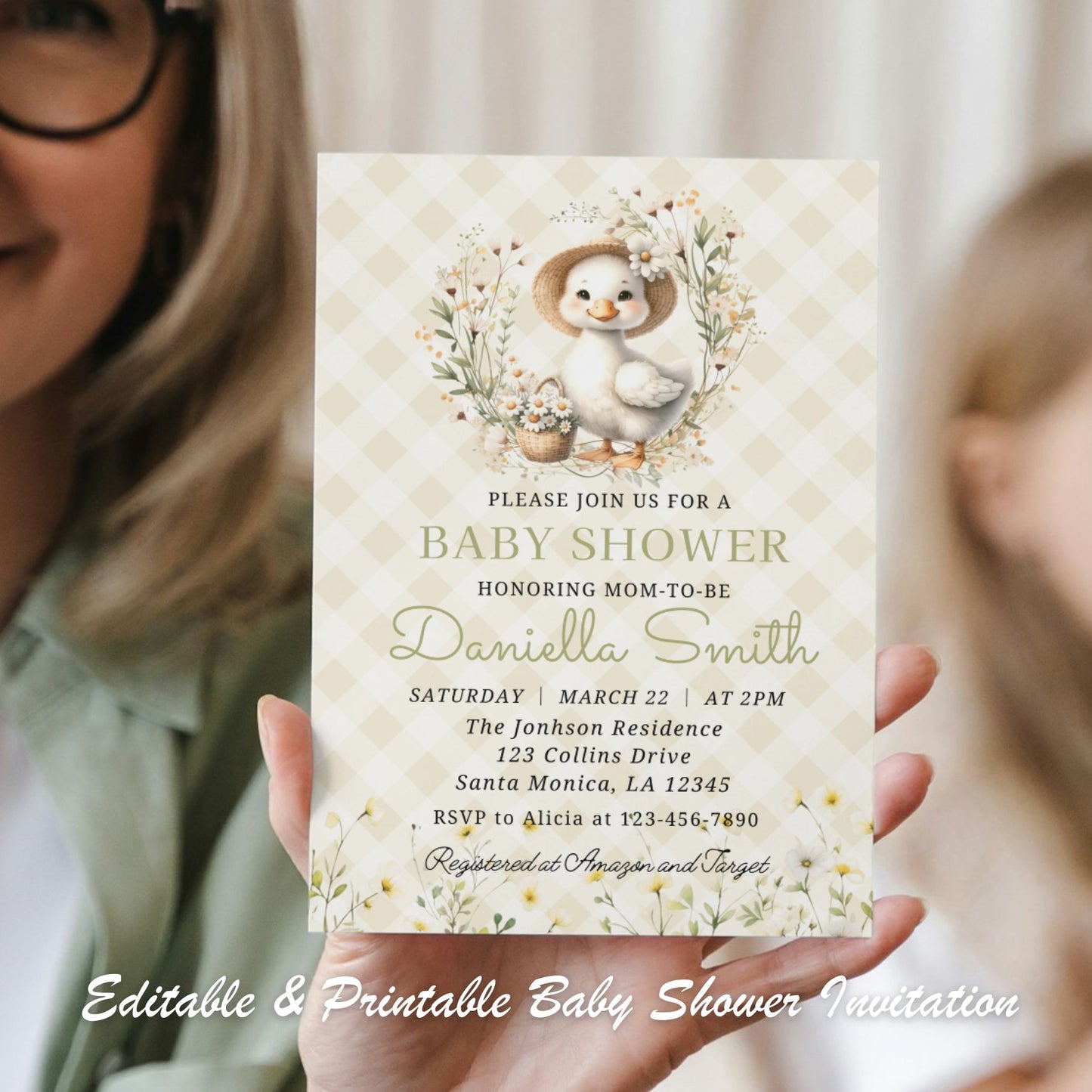 Baby shower invitation with a goose girl design held by a person