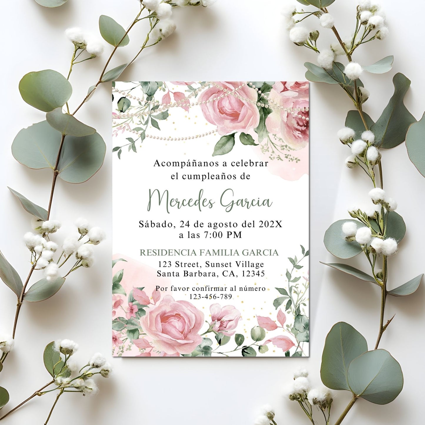 Invitation card with Pink floral and pearls design surrounded by decorative plants on a white background