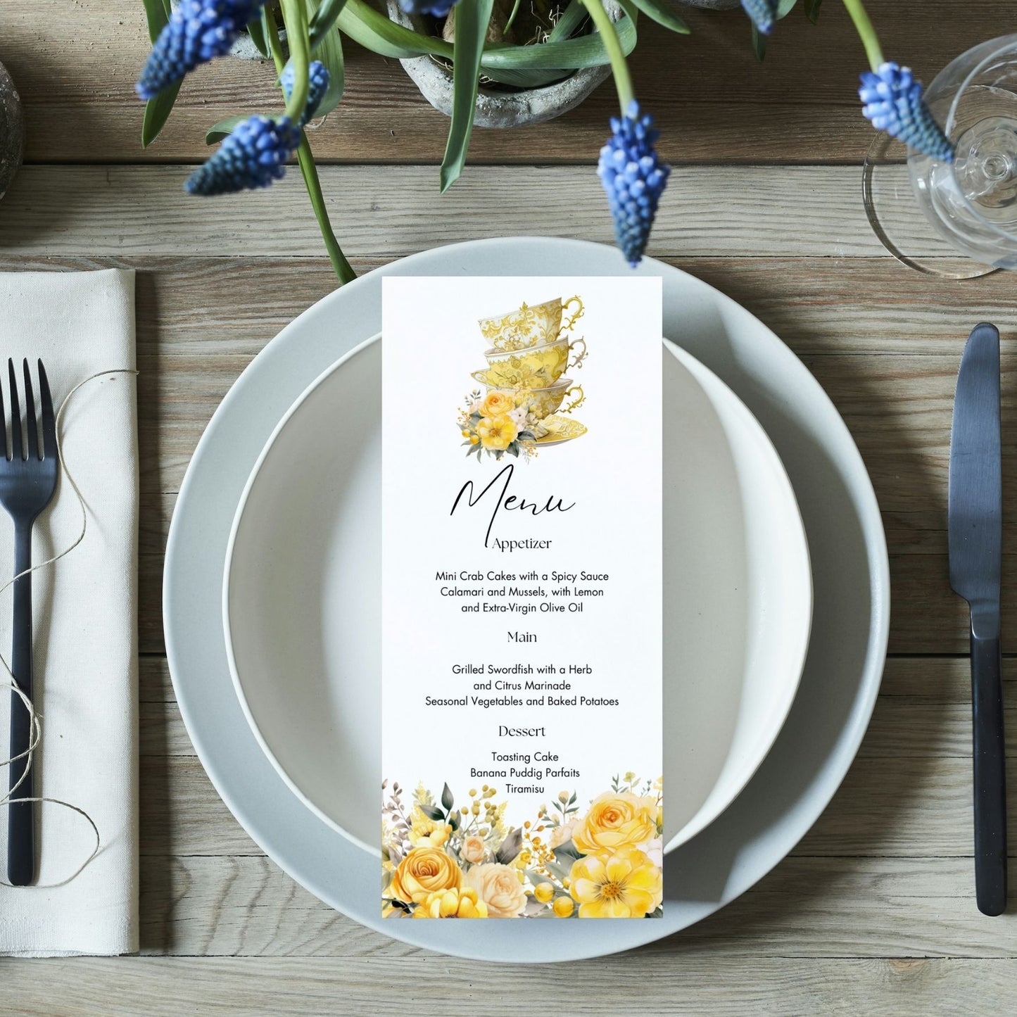 Editable Menu card with floral and cup design on a table setting with plates, cutlery, and flowers.