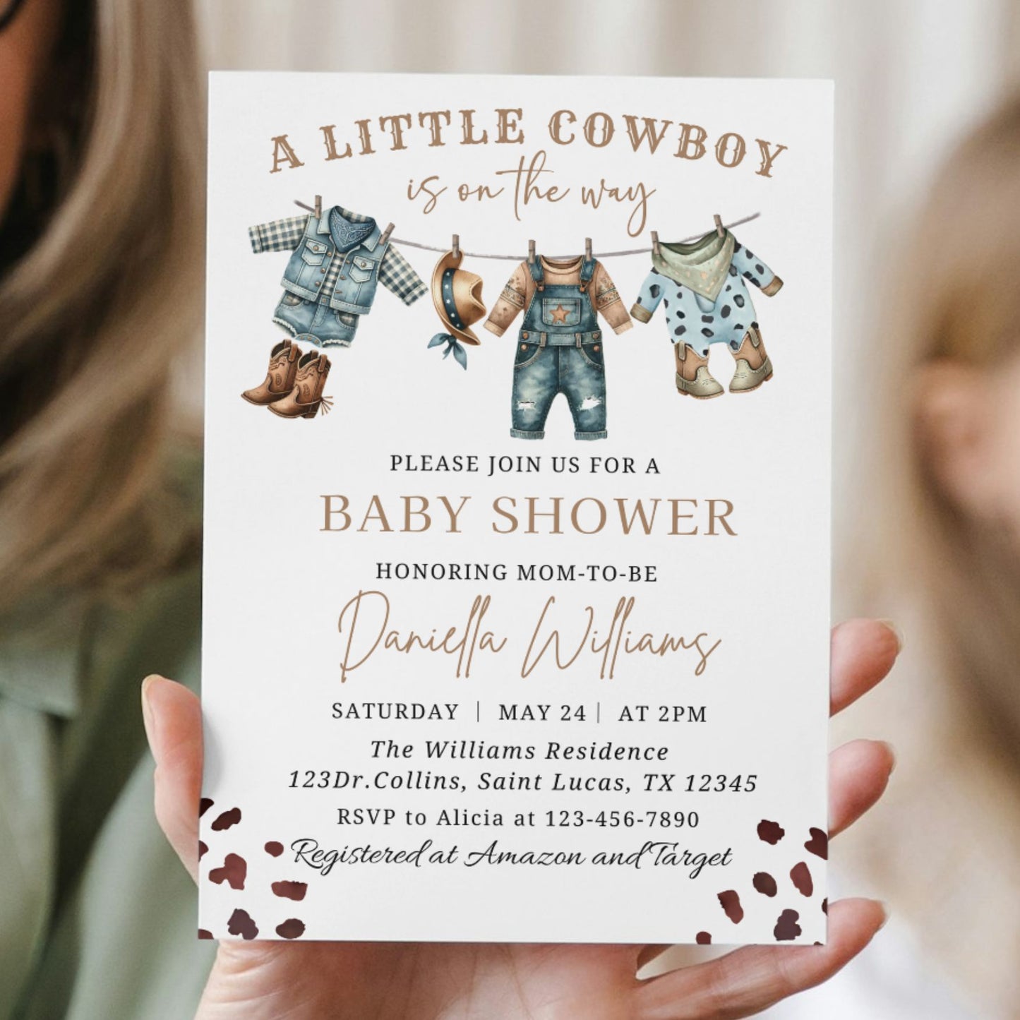 Baby shower invitation for a little cowboy theme held by two people.