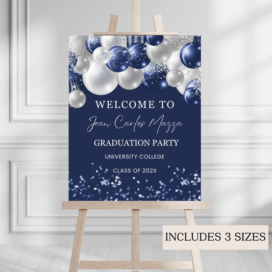 Graduation party invitation with navy and white balloons on a wooden easel against a light gray wall.