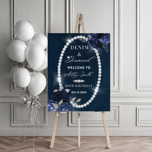 Decorative sign with pearls and flowers on an easel, accompanied by balloons against a gray wall.