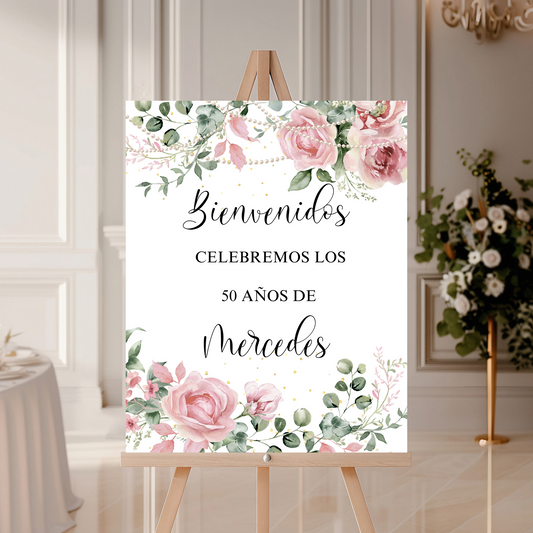 Decorative sign with floral design and text on an easel in a room setting.