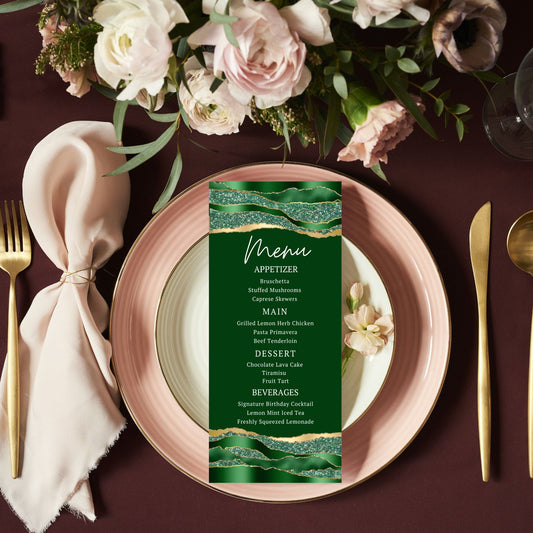 Green Gold Agate menu card on a pink plate with floral decorations and cutlery.
