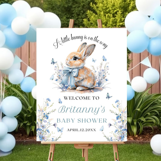 Baby shower sign with a rabbit illustration and balloons outdoors