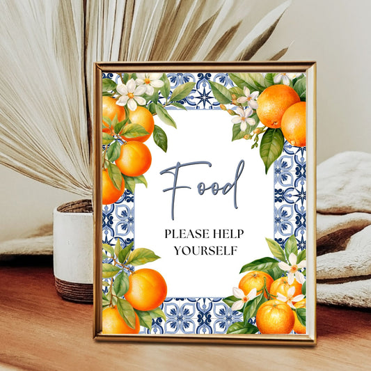 Decorative sign with Blue Tile oranges and flowers on a table