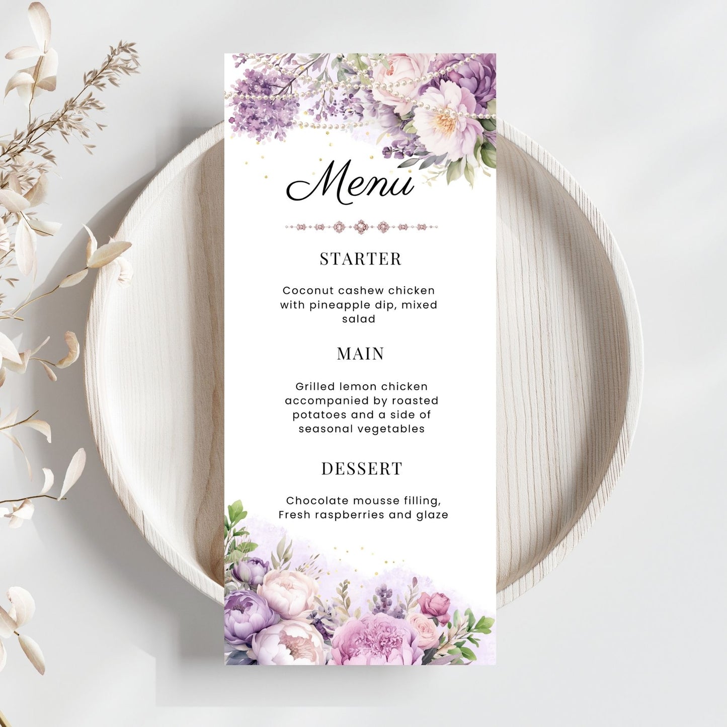 Menu card with purple floral and pearls design on a white plate