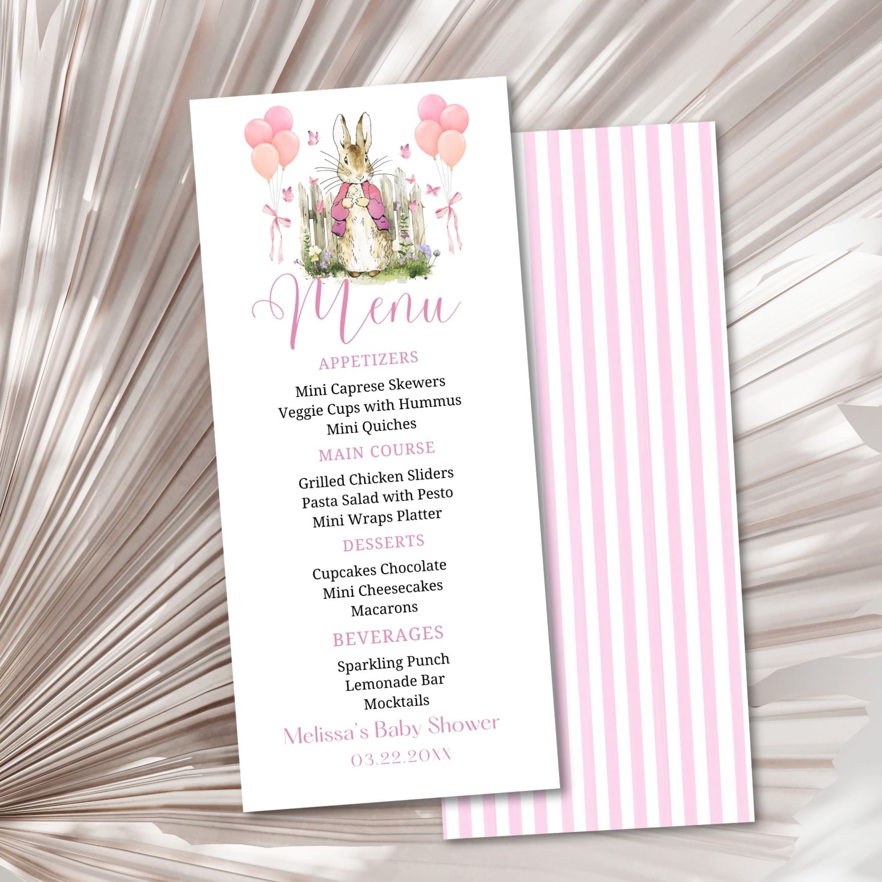 Menu card for a baby shower with a rabbit illustration on a textured surface