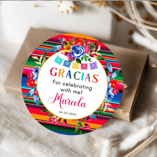 Colorful Mexican round Tag with floral design and text on a white surface