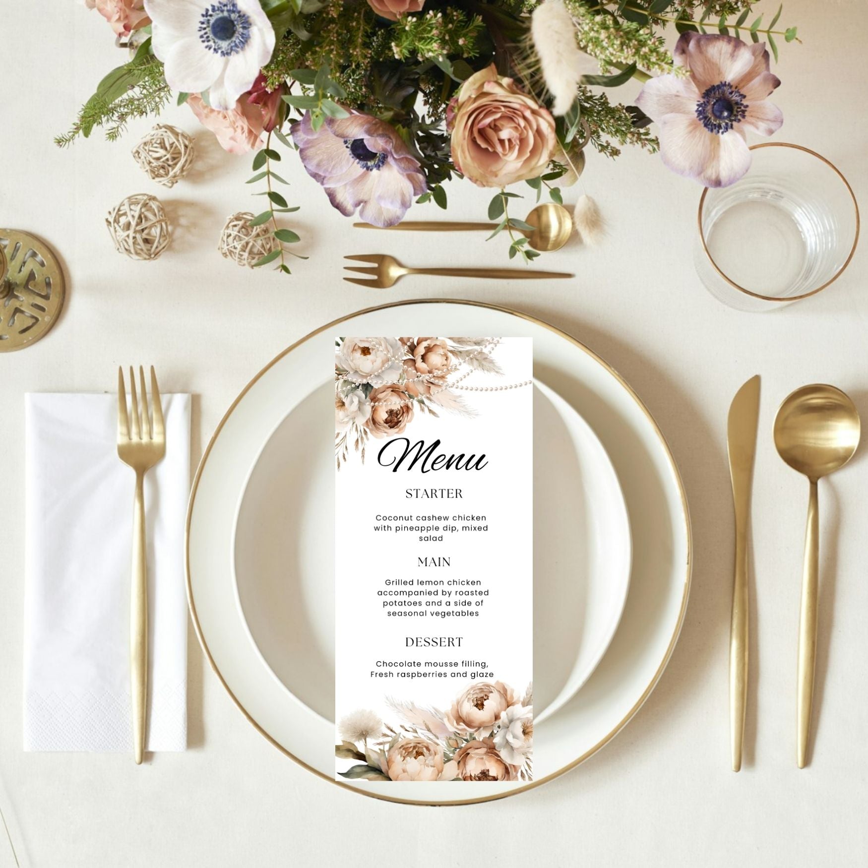Elegant table setting with boho floral ans pearls menu card, plates, and cutlery on a white surface.