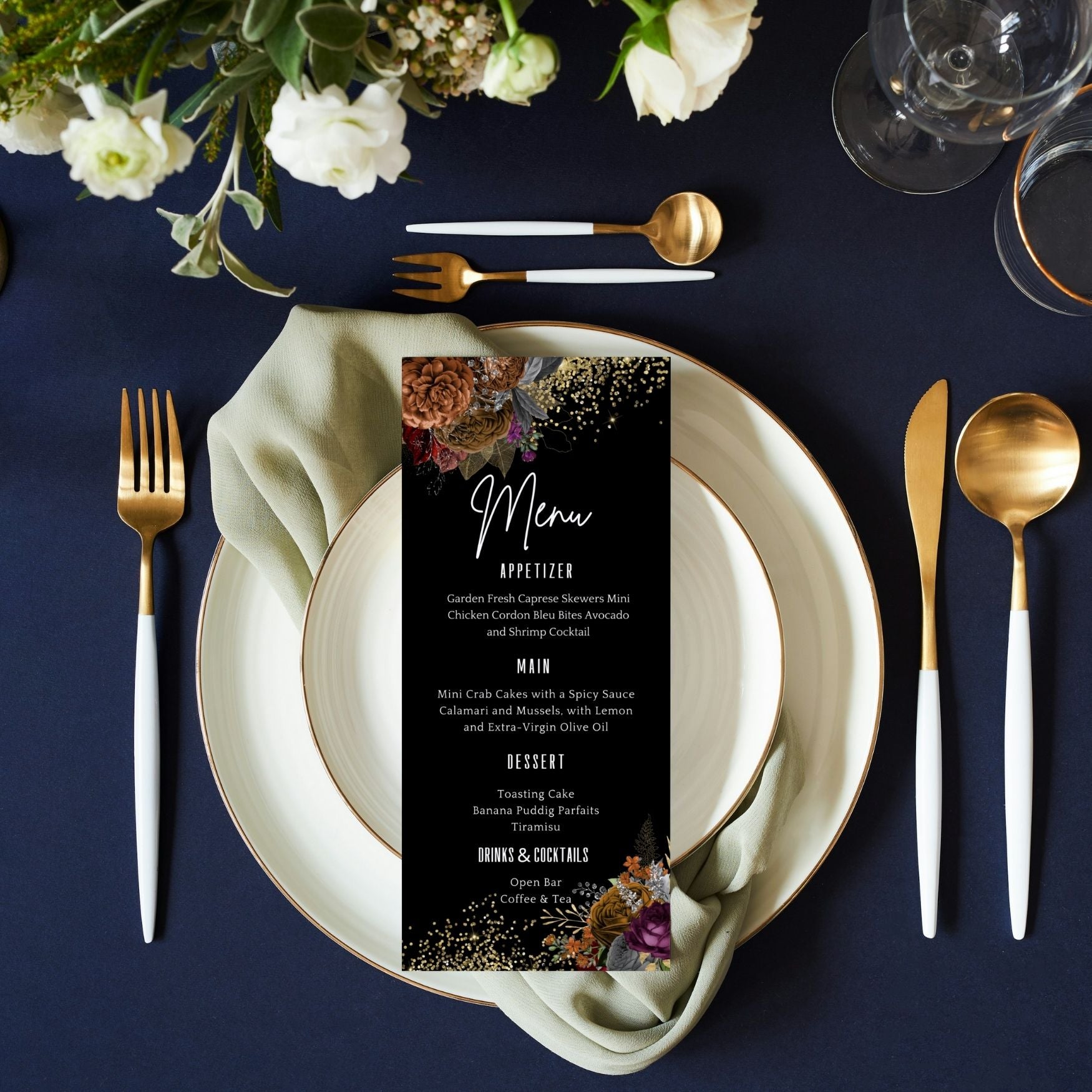 Dining table setting with floral menu card, plates, cutlery, and flowers on a dark surface.