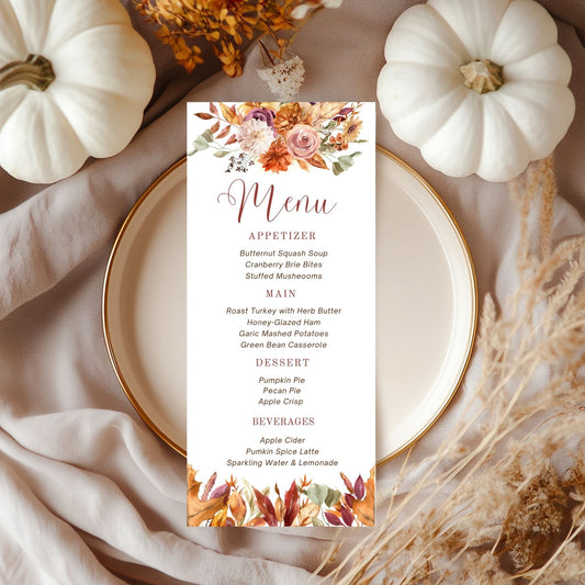 Fall Floral Menu card with autumn-themed design on a plate with pumpkins and dried flowers.