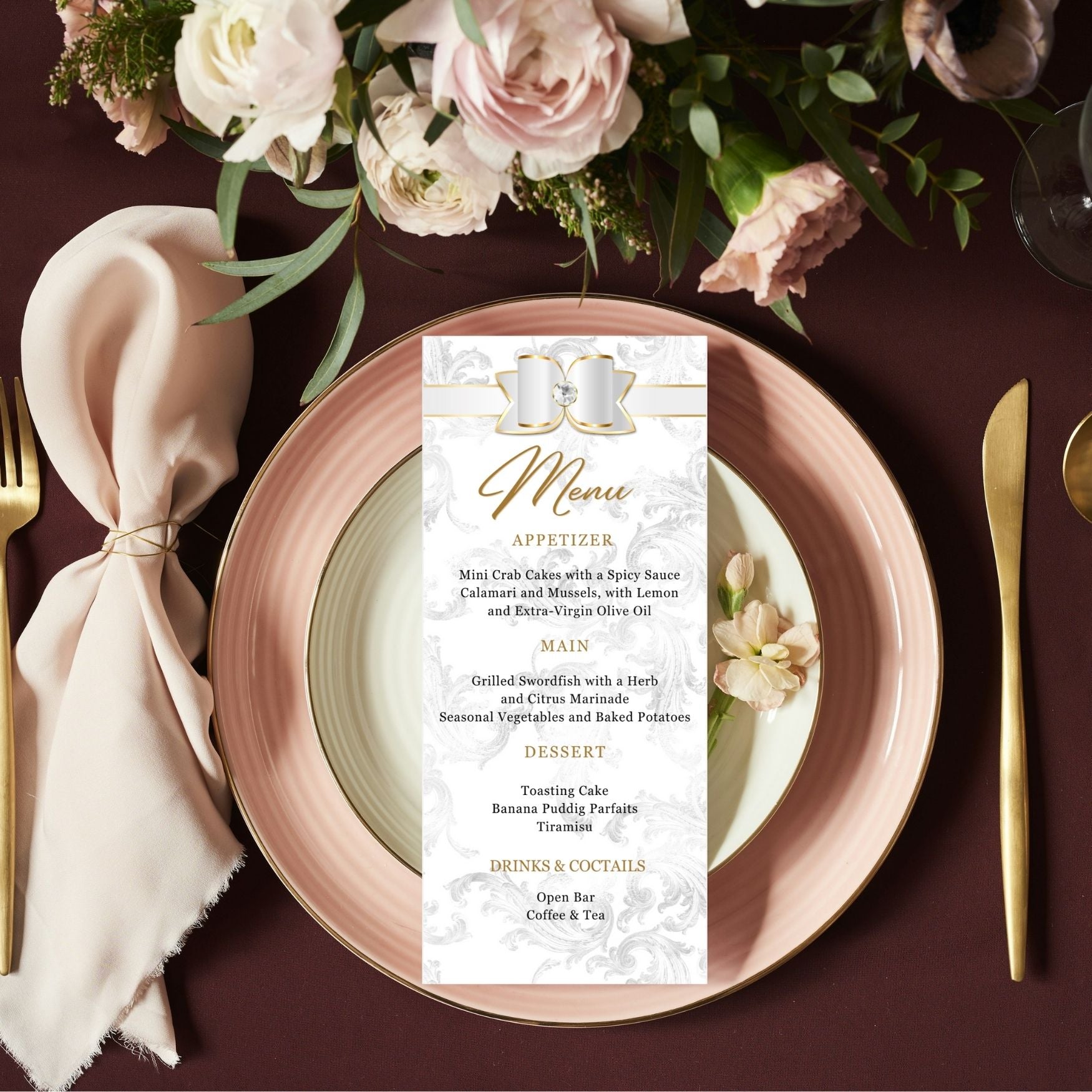 Table setting with a White and gold menu card, plates, and flowers on a dark surfaceite 