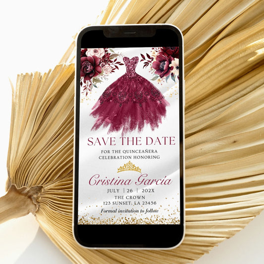 Phone displaying a quinceañera save the date invitation with a burgundy dress and flowers on a white background.