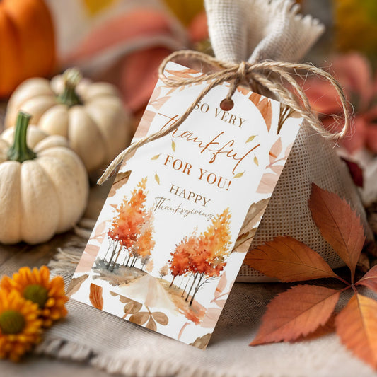 Thanksgiving gift tag with pumpkins and leaves on a wooden surface