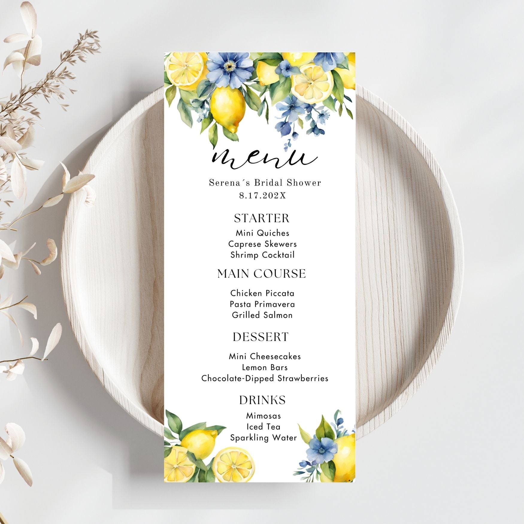 Menu card for a bridal shower with Blue floral and lemon design on a white plate.