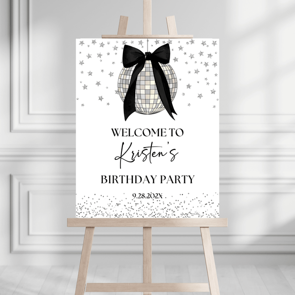 Coquette Black Bow Disco Ball Birthday Party Welcome Sign on an easel, elegant black bow, disco ball decor for parties.