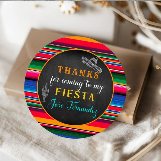 Round colorful Mexican Tag with 'Thanks for coming to my Fiesta' text on a white surface.
