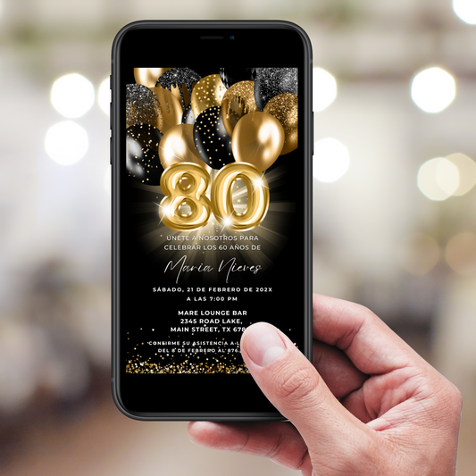 Hand holding a phone displaying a birthday invitation with gold balloons and number '80' on a black background.