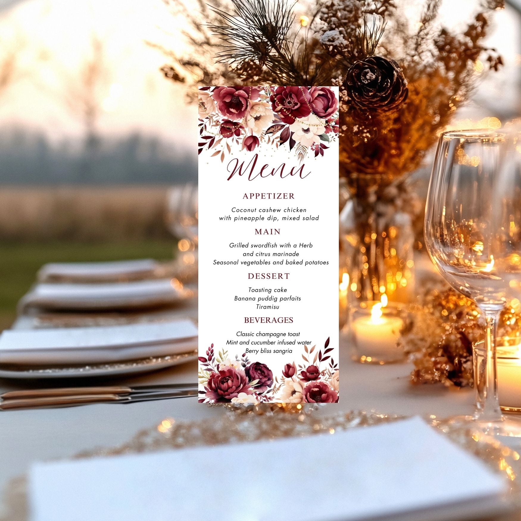 Burgundy Menu card with floral design on a table setting with plates, glasses, and candles.