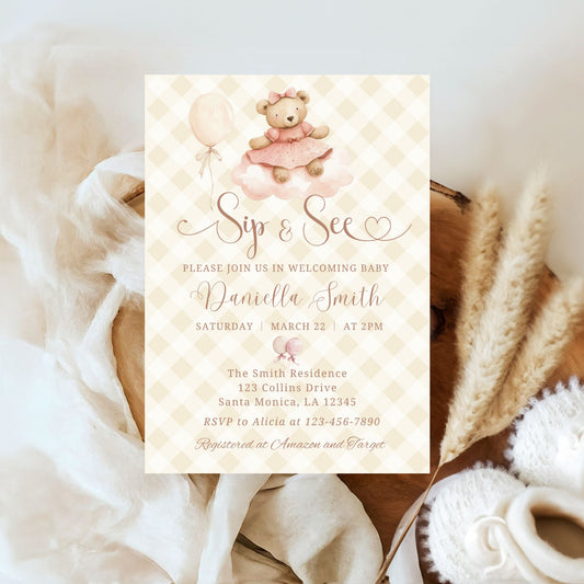 Baby shower invitation with teddy bear and balloons on a textured surface