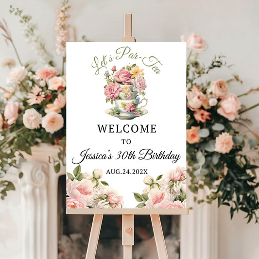 Decorative sign for a tea party birthday celebration with floral elements and text.