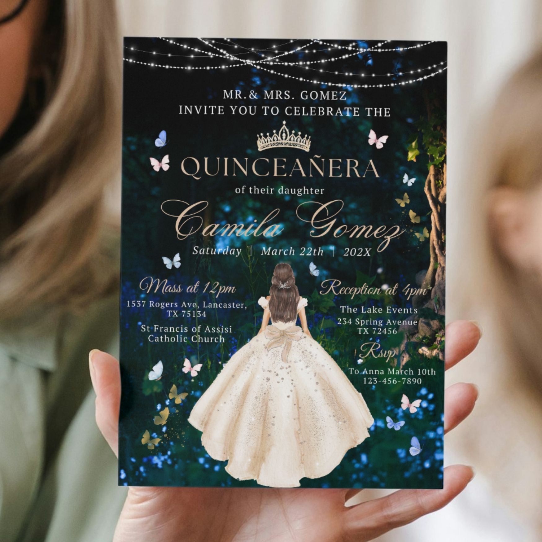Magical Quinceañera invitation held by a person with a dark background featuring butterflies and lights.