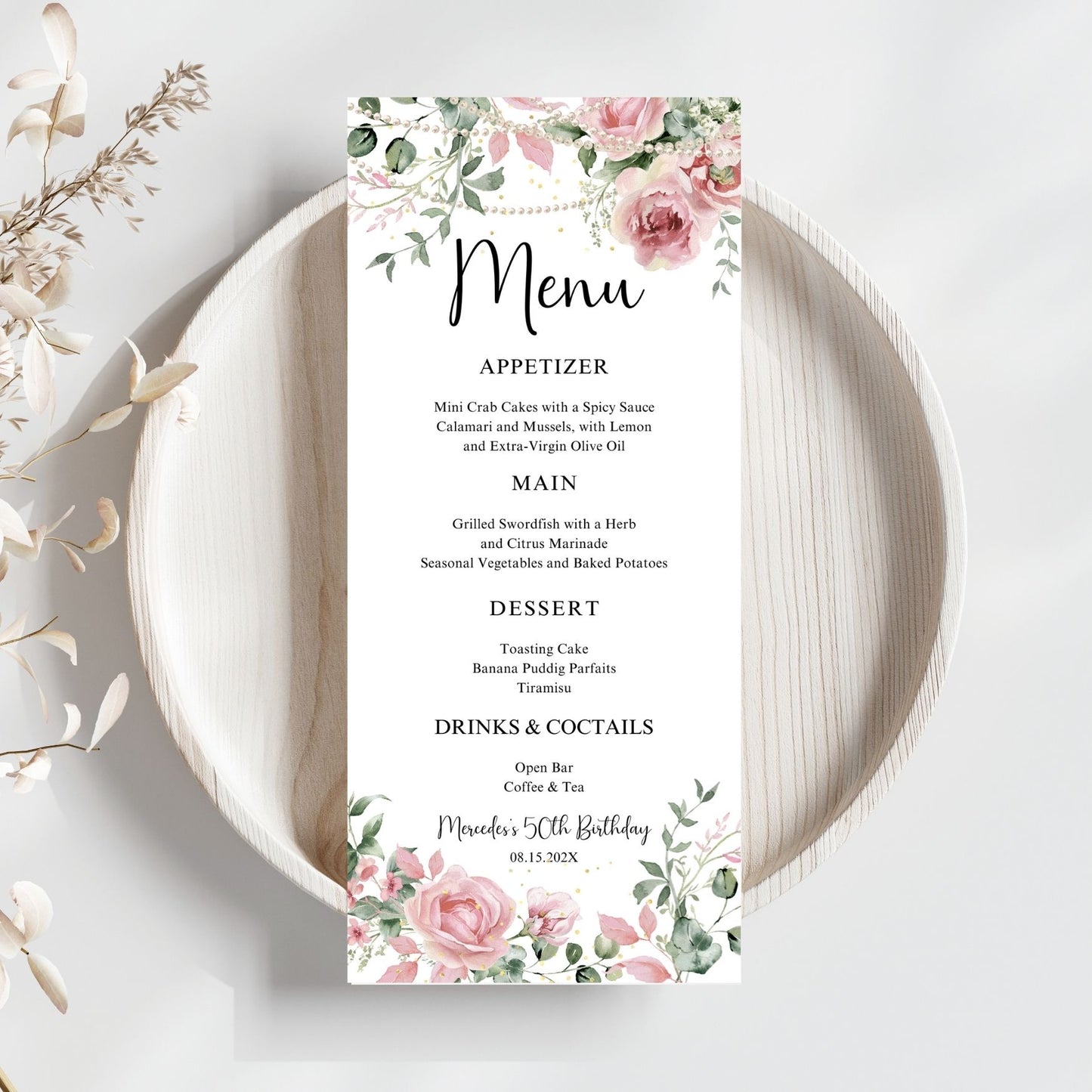 Pink Menu card with floral and pearls design on a white plate