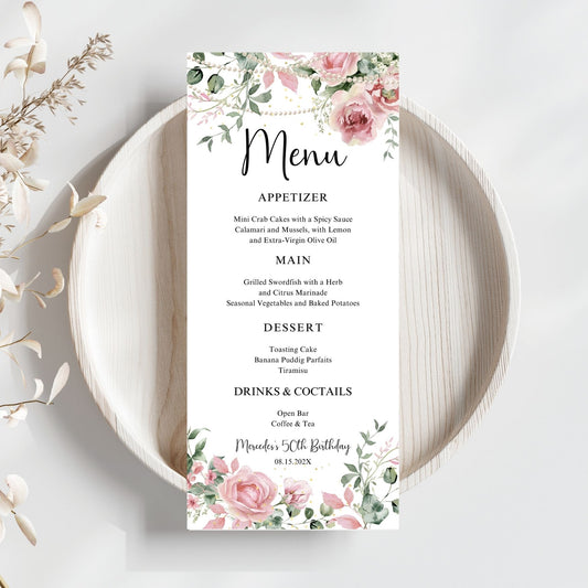 Pink Menu card with floral and pearls design on a white plate