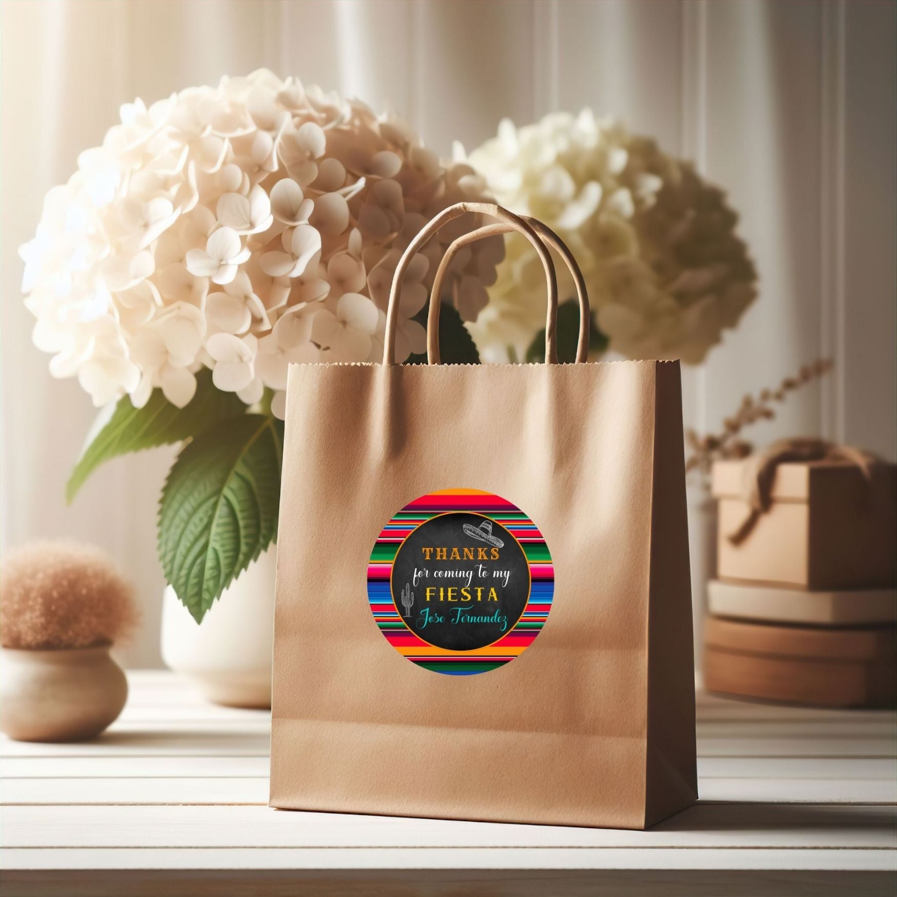 Brown paper bag with a colorful Mexican Serape label on a surface with flowers in the background