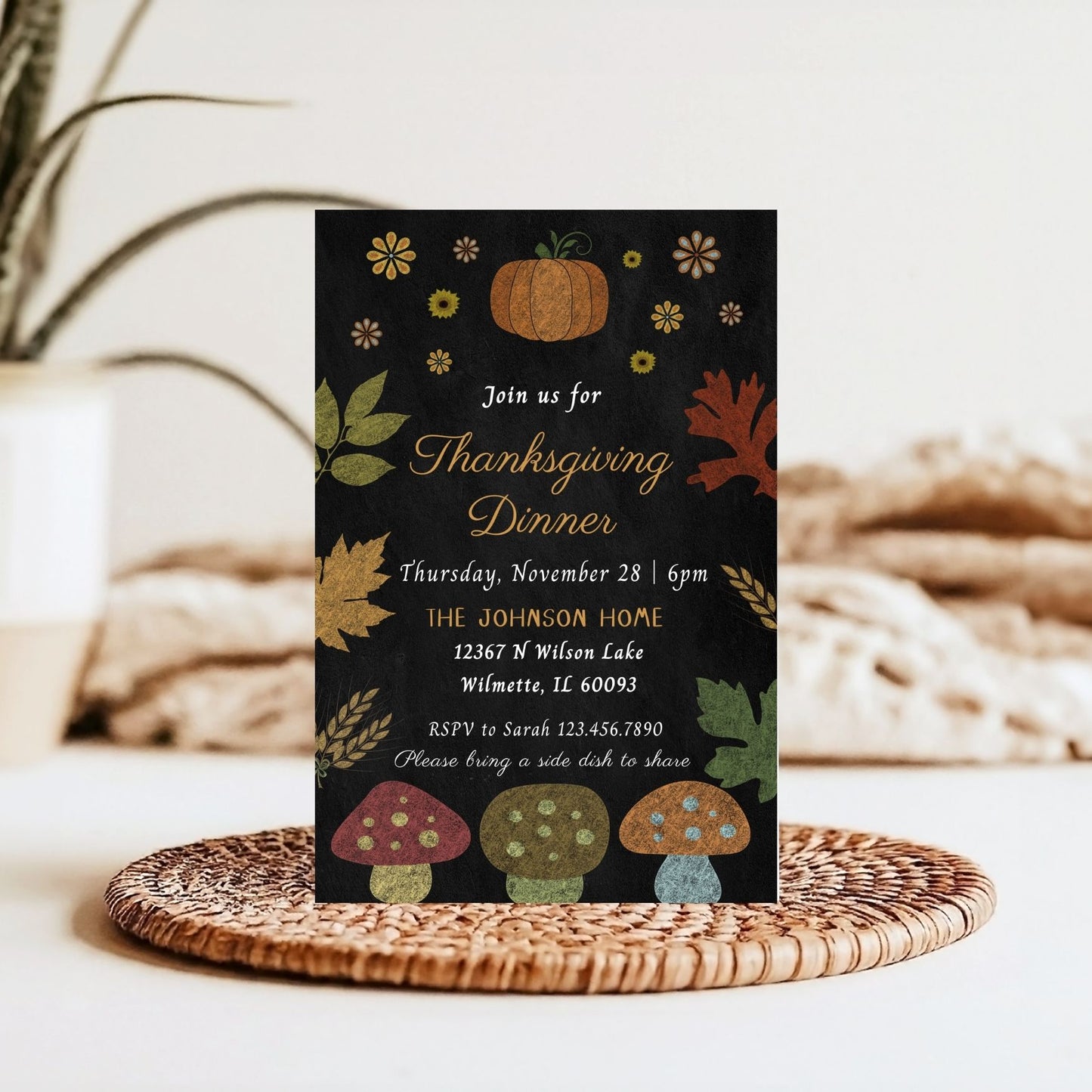 Thanksgiving dinner invitation card with autumn-themed Chalkboard  design on a woven mat.