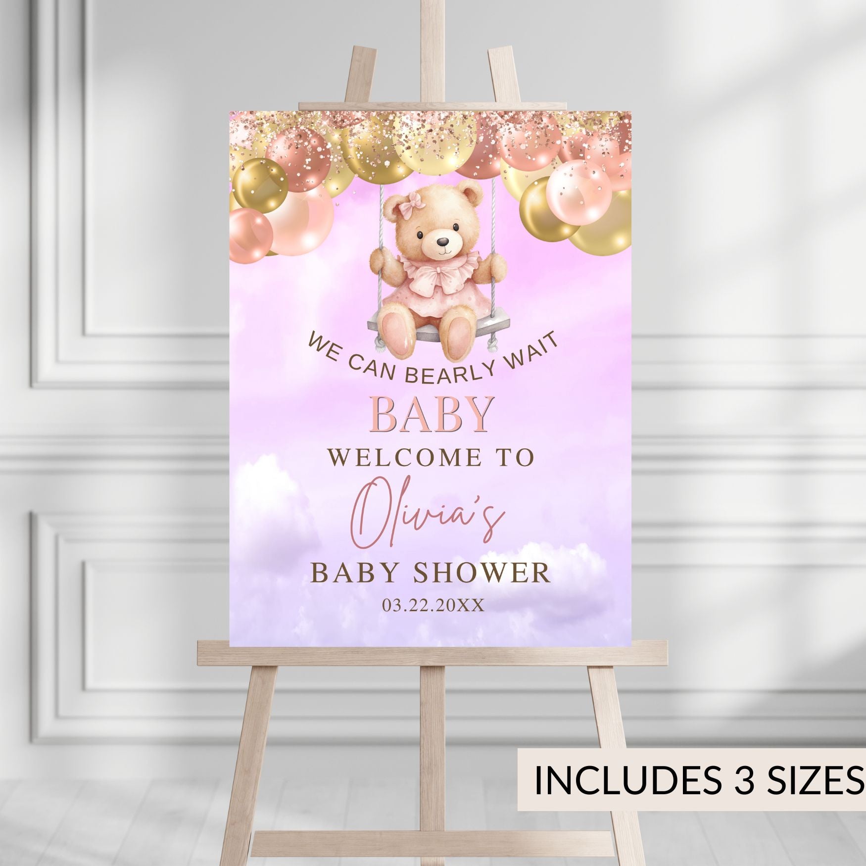 Baby shower sign with teddy bear and balloons on a stand against a white background