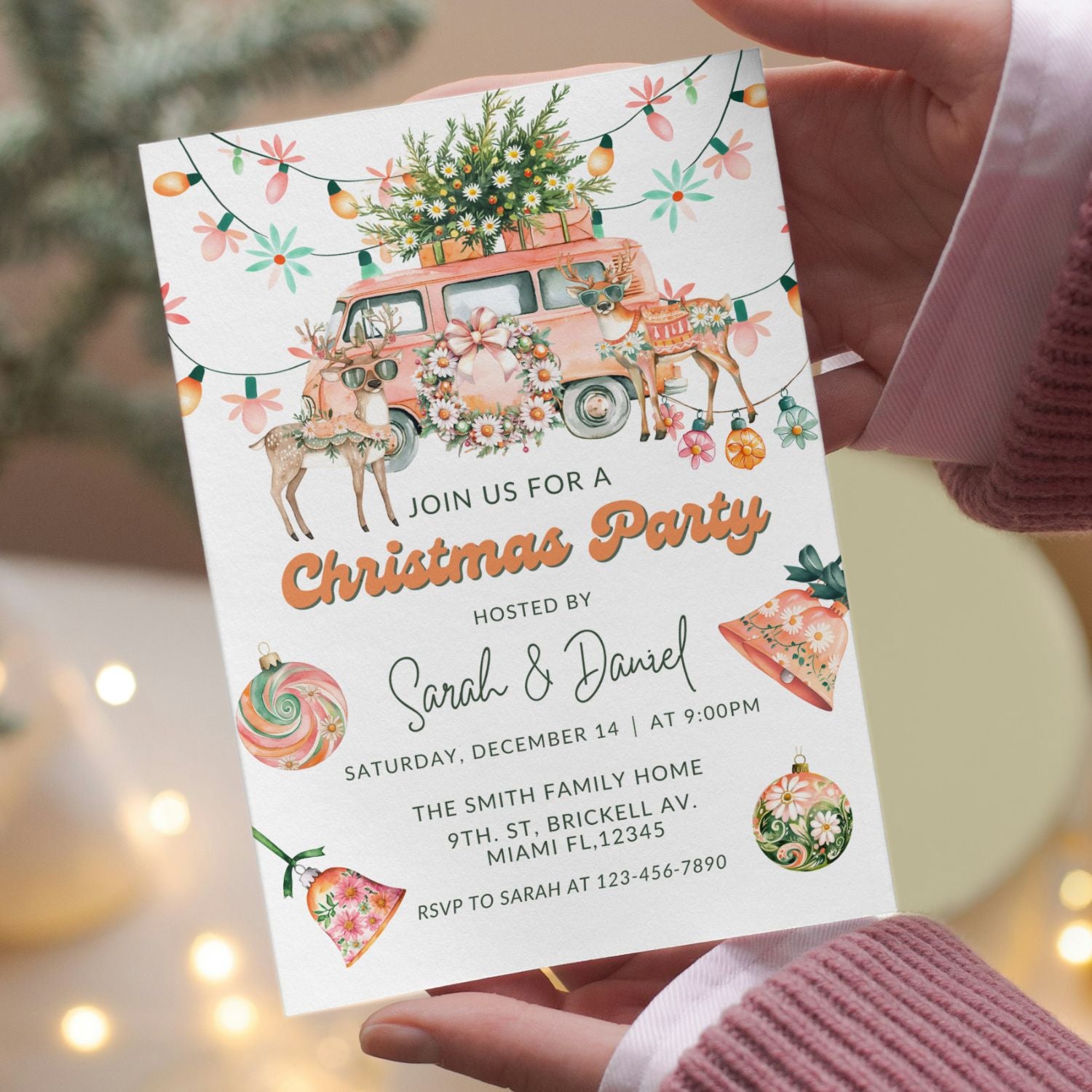 Hand holding a Christmas party invitation with festive elements and a pink van.